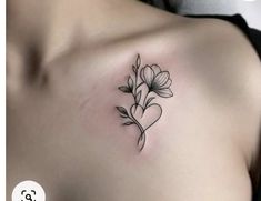 a woman's chest with flowers on it and a heart in the middle that says love