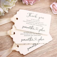 three tags that say thank you and have flowers in the background with ribbons around them