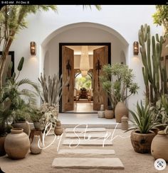 an entrance to a house with potted plants