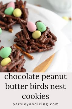 chocolate peanut butter birds nest cookies on a white plate with the words, chocolate peanut butter birds nest cookies