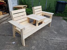 two wooden benches sitting next to each other