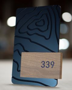 a wooden plaque with the number 399 on it