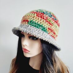 a mannequin head wearing a multicolored crocheted hat