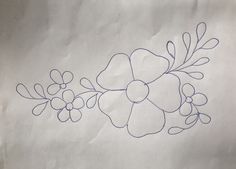 a piece of paper with blue ink on it and an image of flowers in the middle