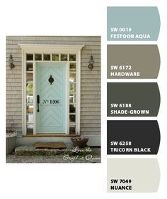 the front door is painted gray and has white trim, which matches the house's exterior color scheme