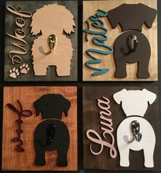 four wooden signs with dogs on them