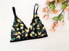 This lace bralette has the sexiness of a sheer lace bra with a fun lemon print that is perfect for summer! Looks great for special occasions, but comfortable enough for everyday wear. BRALETTE: Adjustable straps, zinc alloy (metal) hardware. The Jordan de Ruiter collection is hand crafted in Canada in-studio & by small run manufacturers. Made to order, please see the shipping section for current turnaround on this item. Sizing: S/M: Fits bands 32-34, most cup sizes M/L: Fits bands 36-38, most cu Black Lace Bra, Bra Lace, Cup Sizes, Triangle Bralette, Lemon Print, Lace Lingerie, Lace Bralette, Lace Bra, Sheer Lace