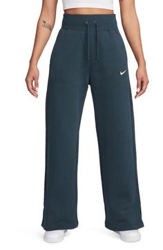 Get incredibly comfy in these wide-leg sweats cut from cozy brushed fleece and finished with split hems so you can show off your favorite footwear. 31" inseam; 23" leg opening; 13 1/2" front rise; 17 1/2" back rise (size Medium) 31 1/2" inseam; 24" leg opening; 14 1/2" front rise; 19" back rise (size 2X) Drawstring waist Side-seam pockets 80% cotton, 20% polyester Machine wash, tumble dry Imported Comfortable Nike Sweatpants, Comfortable Nike Sweats, Cozy Nike Sweats, Wide Leg Sweatpants For Sports In Fall, Wide Leg Sweatpants For Fall Sports, Sporty Wide Leg Sweats For Fall, Sporty Wide-leg Sweats For Fall, Nike Wide Leg Cotton Sweatpants, Nike Cotton Wide-leg Sweatpants