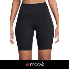 a woman in black shorts with the words macy's written on her chest and bottom