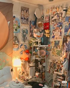 a room with many pictures and stuffed animals on the wall, including teddy bear toys