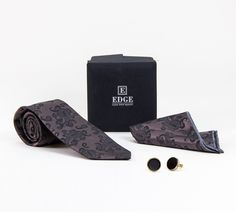 Get three items in one gift set with a tie, matching handkerchief and cufflinks. Presented nicely in a classic black box. Includes a tie, handkerchief and cufflinks Handkerchief Dimensions: Approx 11" W x 11" L Cufflinks Black Tie Cufflinks For Father's Day, Black Cufflinks For Black Tie And Father's Day, Black Cufflinks For Black Tie, Father's Day, Elegant Suit And Tie Accessories With Gift Box, Black Suit And Tie Accessories For Father's Day Gift, Black Suit And Tie Accessories For Father's Day, Elegant Suit And Tie Accessories Gift Box, Elegant Adjustable Suit And Tie Accessories For Gifts, Elegant Cufflinks With Gift Box For Father's Day