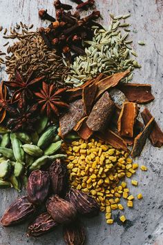 an assortment of spices and herbs on a table