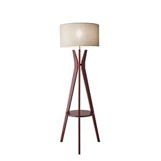 a wooden floor lamp with a white shade on the base and a round light fixture