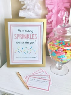 a sign that says how many sprinkles are in the jar? next to some candy