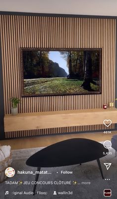 a flat screen tv mounted to the side of a wooden wall in a living room