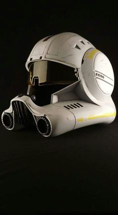 a white helmet and goggles on a black background