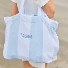 Meet our vacation-ready Beach Bag. Sized to fit sunny day essentials, our terry tote is perfectly packable for weekends away. Made of our fan-favorite Light Blue Stripe Beach Towel, the long straps and pocket make for sun, sand and swim made Weezie. Beach Bag Gift Basket, Summer Basket, Stripe Embroidery, Beach Bag Gift, Yacht Interior Design, Striped Beach Towel, Yacht Interior, Pool Bags, Summer Stuff