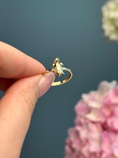 This turtle-shaped ring is a whimsical and charming piece of animal-themed jewelry. With intricate details that capture the essence of a turtle, it's a stylish way to showcase your love for these fascinating creatures and add a touch of nature-inspired flair to your style. Product Specifications:  * Material: 14K Solid Gold, hallmarked 14K or 585 for authenticity Delivery:  * Ready to ship in 1 business day. * Delivers in 1 to 5 days depending on location and delivery option. * Returns are accepted within 7 days from the delivery date, at the customers cost. Gift Option: * We cherish the joy of gifting, as do you and your loved ones. Feel free to inform us if            you desire an additional personalized note with your order to make it an even more            special gift. Explore Our O Animal Themed Jewelry, Turtle Ring, Hand Painted Necklace, Animal Ring, Animal Rings, A Turtle, Themed Jewelry, Intricate Details, Rings Statement