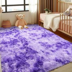 a child's bedroom with a purple rug and teddy bear on the floor in front of it