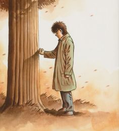 a man standing next to a tall tree