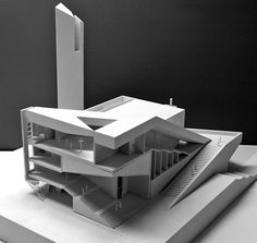 an architectural model of a building on top of a table