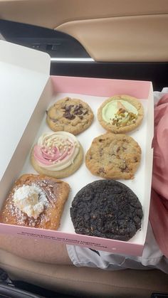 a box filled with lots of different types of cookies