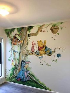 winnie the pooh mural in a children's room