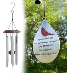 a wind chime hanging from a tree next to a photo of a cardinal bird