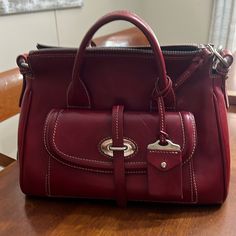 Dooney & Bourke Small Front Pocket Satchel. Color Is A Deep Red. It Cones With Her Own Strap. Please Take A Look At Her Handles And Her Back Does Have Small Stains. Her Front Pocket Did Come With A Crease And That Is How I Bought Her. She Is Still A Beautiful Bag. Inside Shows No Wear. Smoke And Pet Free Home. Bag Inside, Beautiful Bags, Dooney Bourke, Deep Red, Lady In Red, Front Pocket, Take A, Satchel, Look At