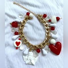 a bracelet with charms and hearts on it