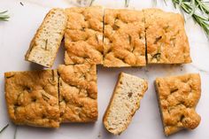 sliced bread with rosemary sprigs on the side