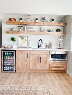 a kitchen with wooden cabinets and open shelves