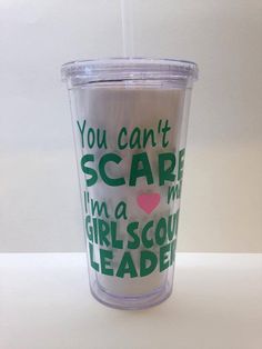 a cup with the words you can't scare i'm a girl scout on it