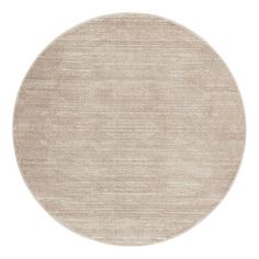 a round rug with an oval design on the bottom in light grey and beige tones