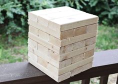 a stack of wood sitting on top of a wooden bench