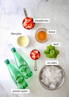 ingredients to make strawberry basil tea on a white marble counter top with text overlay