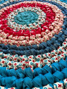 an american flag rug is shown with red, white and blue fabric on the floor