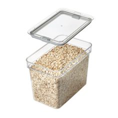 a plastic container filled with oats on top of a white background