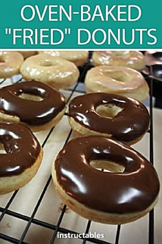 several glazed donuts sitting on a cooling rack with the words oven baked fried donuts