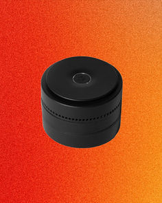 an orange and red background with a black container