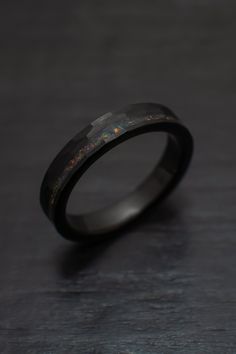 Our gorgeous 4mm Black Obsidian-style Hammered Tungsten Wedding Ring with an beautiful bello balck opal inlay. + Comes in a handmade wax-sealed Ring Box *Durable - Incredible Scratch Resistant Performance to always look great. *Comfort-fit & Weighty - Designed to fit well and feel good in your hand. *Made to order - Every ring we ship is unique and one-of-a-kind. *4mm - Popular Standard width *Hypoallergenic - No discomfort from metals. *Cobalt-Free - Will never turn your finger green or irr Men’s Engagement Rings Black, Male Wedding Bands Tungsten, Masc Ring, Masc Engagement Ring, Masc Rings, Black Wedding Rings For Men, Black Wedding Bands For Men, Black Ring Band, Rings For Men Black