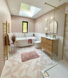 a bathroom with a skylight and pink tiles on the floor, along with a white bathtub