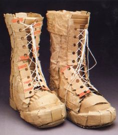 an old pair of boots that have been made out of cardboard