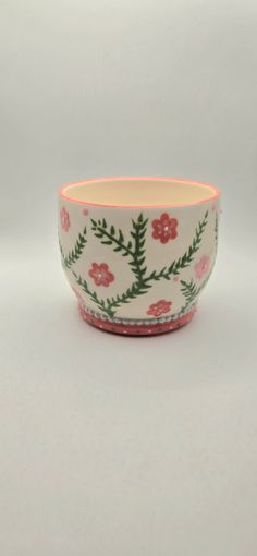 This is a small handcrafted porcelain flower pot. This lovely piece was meticulously hand thrown and then hand painted by Shay Vogel. Finished with a glossy clear glaze on the outside and left unglazed on the inside, this planter is perfect for your succulents or small plants. Plant Pot Ideas, Pink Flower Pot, Painted Plant Pot, Mud Hut, Fun Planters, Clay Plant Pots, Ceramic Succulent Pots, Painted Pot, Pottery Inspo