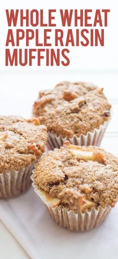 three muffins sitting on top of a white plate with the words whole wheat apple raisin muffins