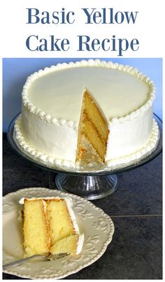 a white cake sitting on top of a table next to a plate with a slice cut out of it