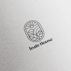 a logo for a tea house that is designed to look like an oval shaped window