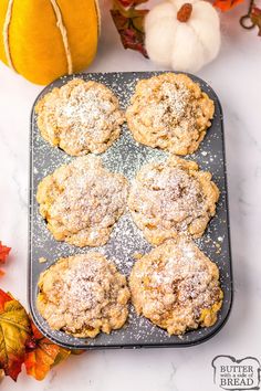 pumpkin spiced cookies on a baking sheet with fall leaves and acorns in the background