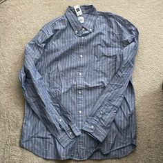 New With Tags Mens Shirt Size Large Blue With Stripes Made By Gap Long Sleeve Shirt Gap Blue Relaxed Fit Shirt, Gap Blue Shirt Relaxed Fit, Gap Blue Long Sleeve Shirt, Blue Relaxed Fit Gap Shirt, Blue Relaxed Fit Shirt By Gap, Casual Blue Button-up Dress Shirt, Blue Long Sleeve Gap Shirt, Gap Blue Collared Top, Blue Collared Tops By Gap