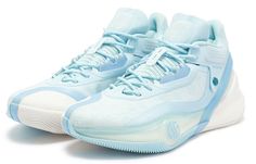 a pair of blue and white sneakers on a white background